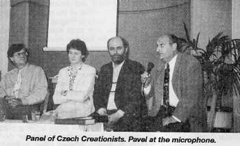 [Picture - Panel of Czech Creationists. Pavel at he microphone.]
